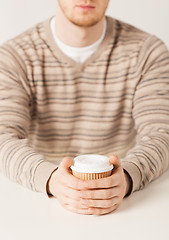 Image showing man hand holding take away coffee cup