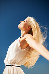 Image showing beautiful woman enjoying summer outdoors