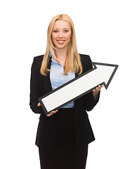 Image showing smiling businesswoman with direction arrow sign