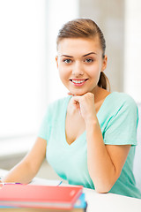 Image showing happy smiling student girl with books