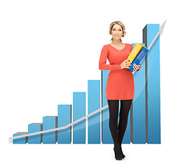 Image showing businesswoman with big 3d chart and folders