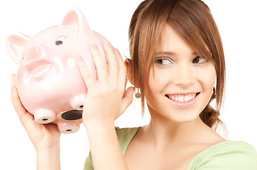 Image showing lovely girl with big piggy bank