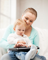 Image showing mother and adorable baby with tablet pc