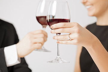 Image showing engaged couple with wine glasses