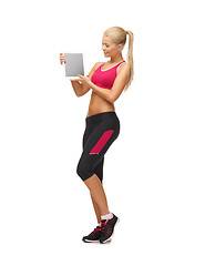 Image showing sporty woman with tablet pc