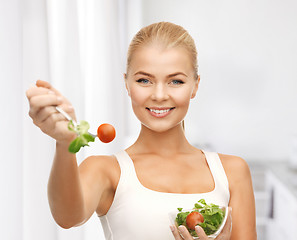 Image showing healthy woman holding bowl with salad