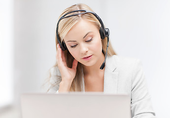 Image showing female helpline operator with laptop