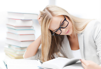 Image showing student with books and notes