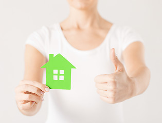 Image showing woman hands holding green house