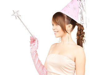 Image showing girl in party cap with magic stick