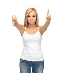 Image showing woman with thumbs up and down