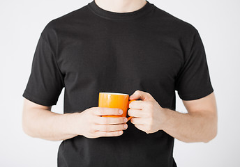 Image showing man hands holding cup of coffee