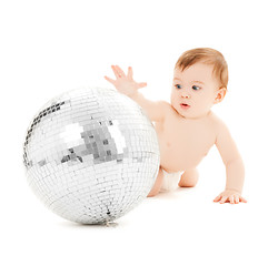 Image showing child playing with disco ball