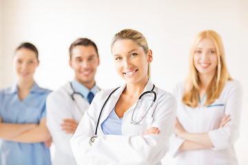 Image showing female doctor in front of medical group