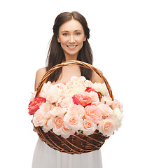 Image showing woman with basket full of flowers