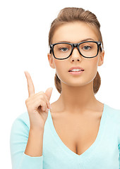 Image showing woman in glasses with finger up