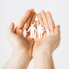 Image showing man hands with paper men