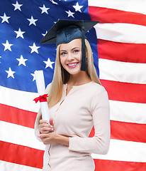 Image showing student in graduation cap with certificate