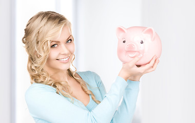 Image showing lovely woman with piggy bank