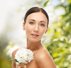 Image showing beautiful woman with white flower