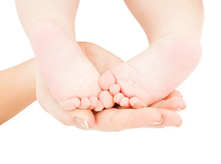 Image showing mother's hand holding baby feet