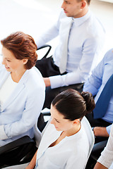 Image showing businessmen and businesswomen on conference