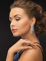 Image showing woman with earrings and ring