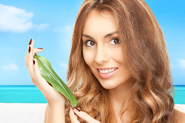 Image showing woman with green leaf