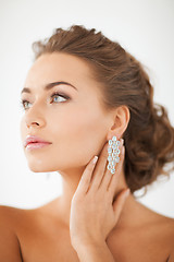 Image showing woman wearing shiny diamond earrings