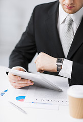 Image showing man with tablet pc and cup of coffee