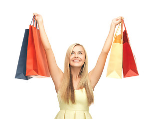 Image showing excited woman with shopping bags