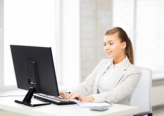 Image showing businesswoman with computer in office