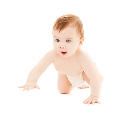 Image showing crawling curious baby