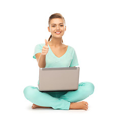 Image showing girl with laptop showing thumbs up