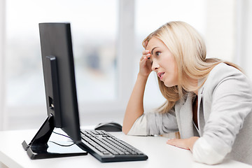 Image showing stressed woman with computer