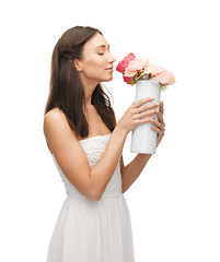 Image showing woman with vase of flowers
