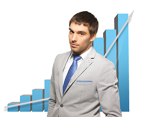 Image showing handsome businessman with big 3d chart