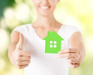 Image showing woman hands holding green house