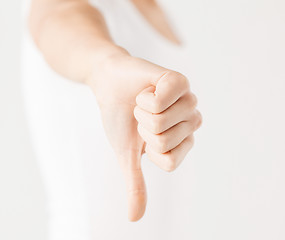 Image showing woman showing thumbs down