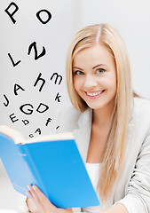 Image showing young woman reading book