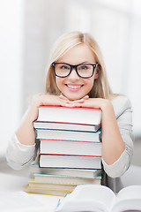 Image showing student with stack of books