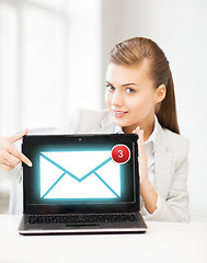 Image showing businesswoman with laptop in office