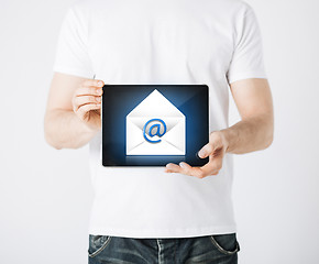 Image showing man holding tablet pc with email sign