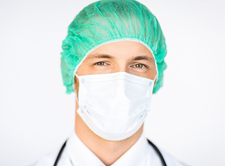 Image showing surgeon in medical cap and mask