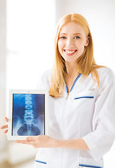 Image showing female doctor with x-ray on tablet pc