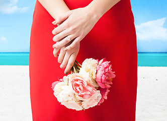 Image showing woman hands with flowers and ring