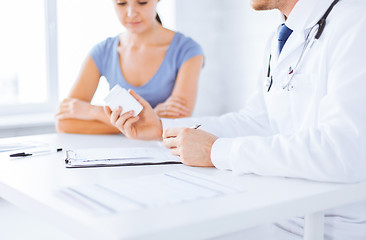 Image showing patient and doctor prescribing medication