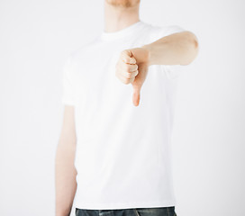 Image showing man showing thumbs down