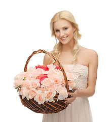 Image showing woman with basket full of flowers