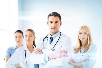 Image showing male doctor in front of medical group